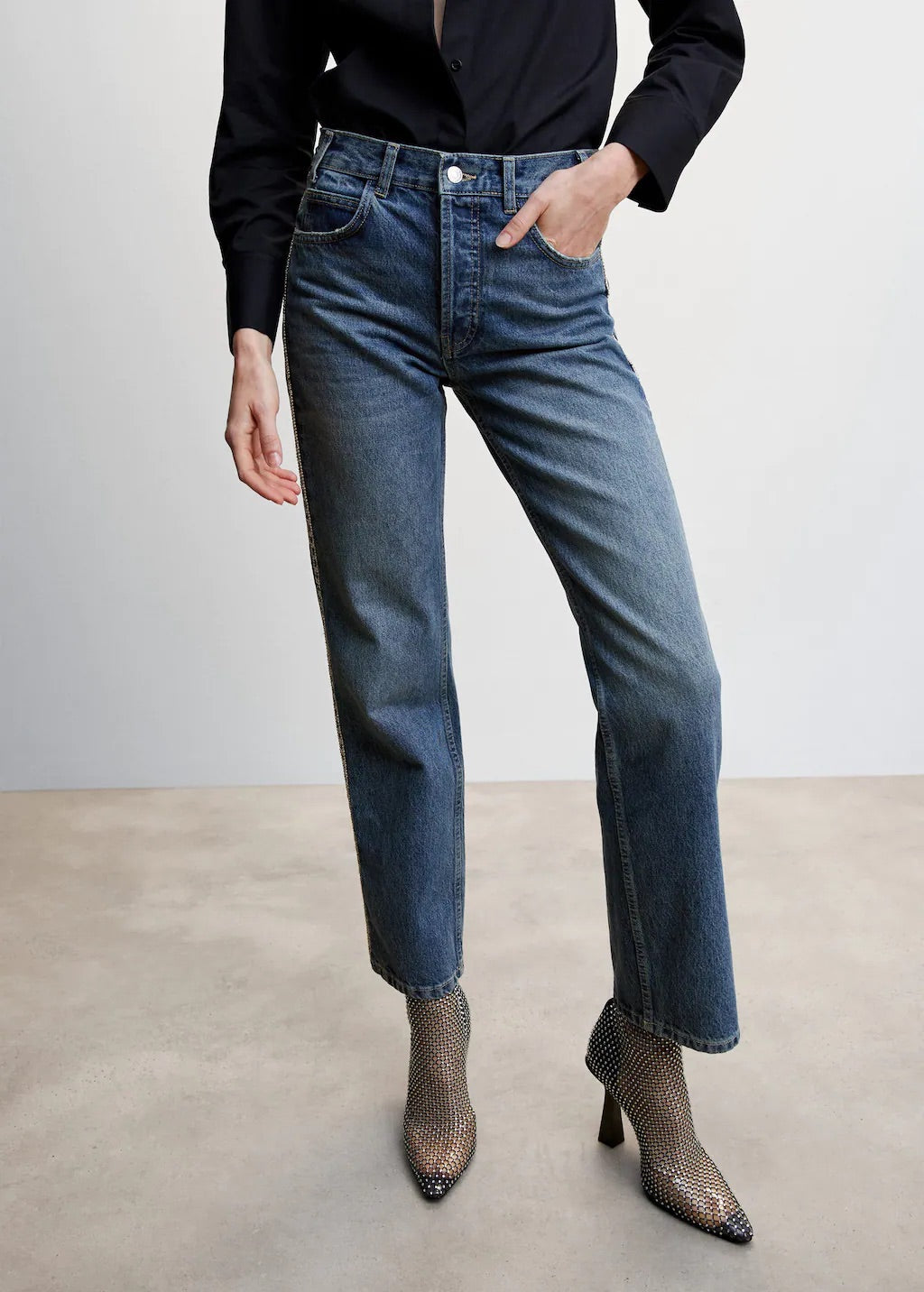Straight jeans with crystal detail on the sides