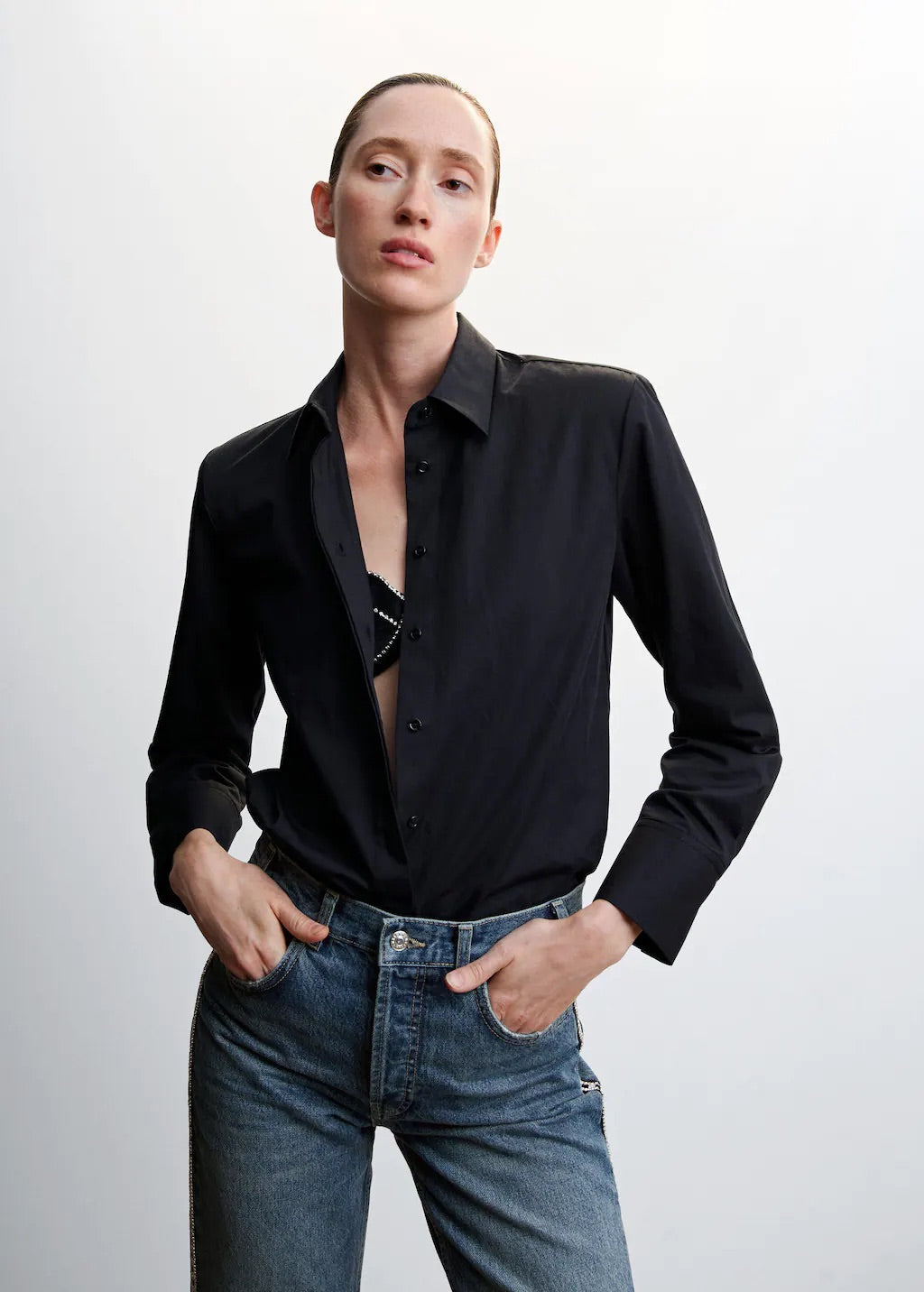 Straight jeans with crystal detail on the sides