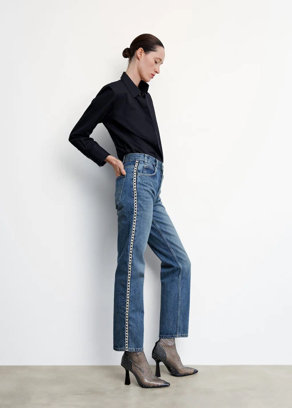 Straight jeans with crystal detail on the sides