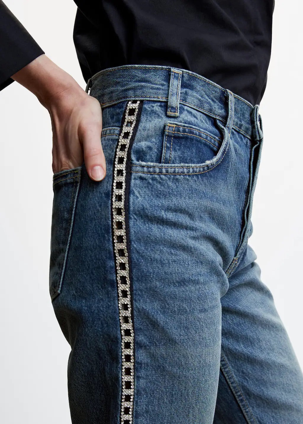 Straight jeans with crystal detail on the sides
