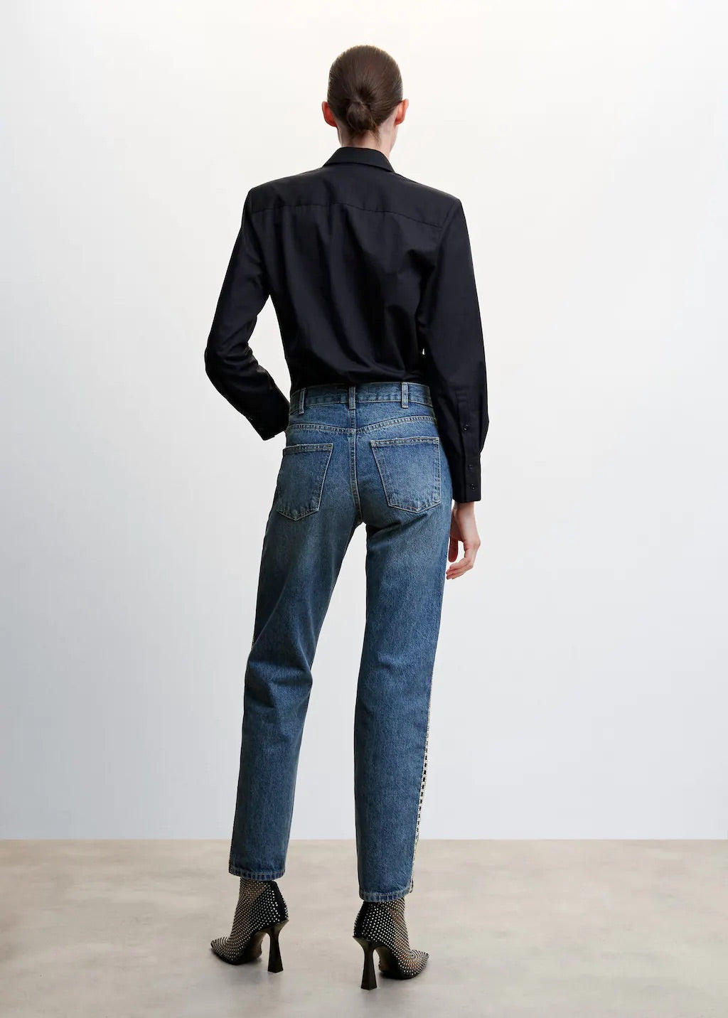 Straight jeans with crystal detail on the sides